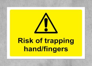 Picture of Warning sign Risk of trapping hand finger safety sign - Self adhesive sticker 75mm x 50mm